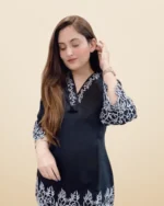 A beautifully designed Kurti Pant Set with detailed embroidery & shimmering sequin work.