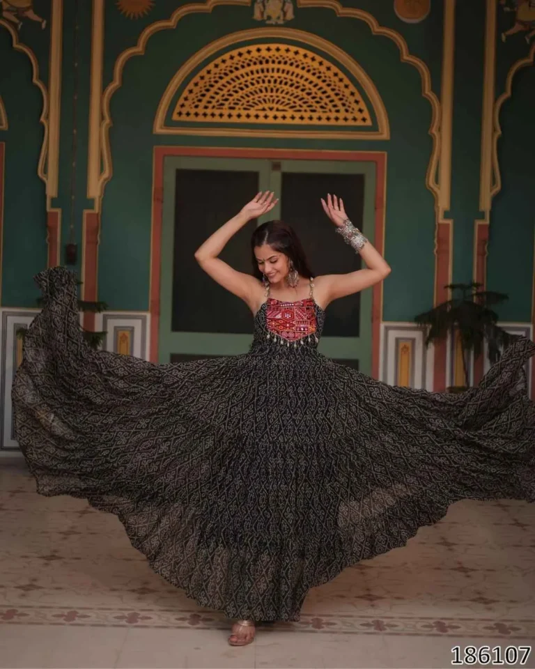 Maroon Bandhani print gown, full flared anarkali, Kutchi patchwork yoke, festive Indian dress, model twirling