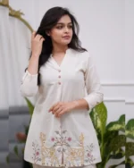 White embroidered kurta set, full view, smiling model, cotton flex ethnic wear, Indian fashion