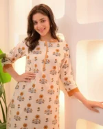 Orange floral print kurta, cotton fabric, lace detailing, traditional print close up